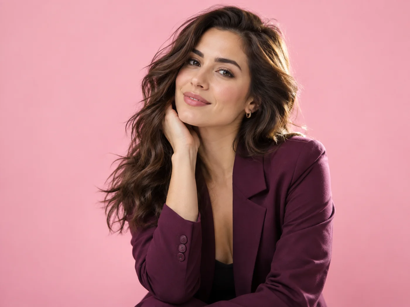 Lifestyle portrait photographed against a soft pink studio background